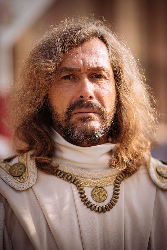 Portrait of man in traditional medieval costume ahead of the Palio di Asti