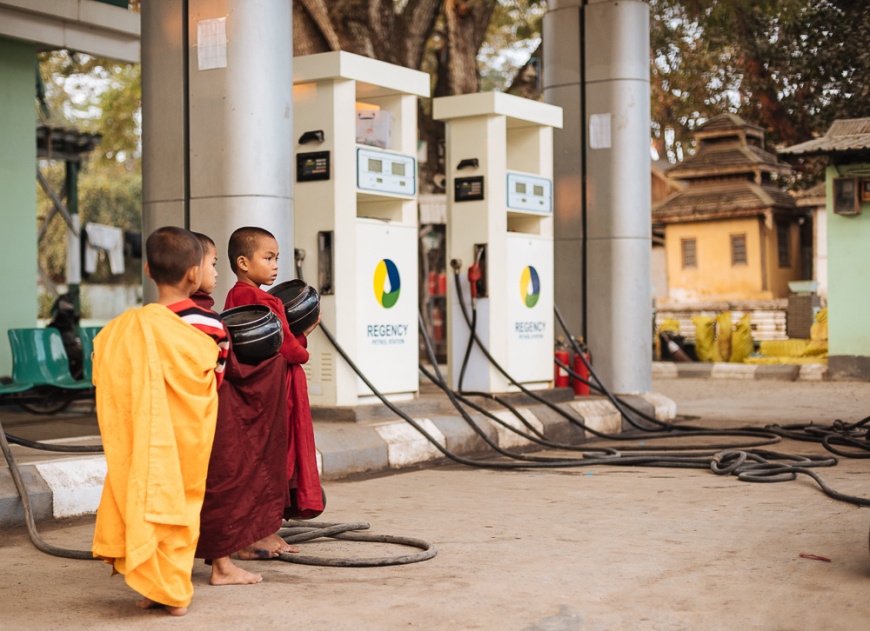 Young Novice monks waiting for alms at petrol station, Hsipaw, Shan State, Myanmar, Asia