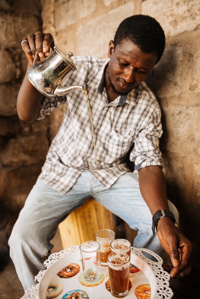 Man making traditional tea, Accra, Ghana, Africa